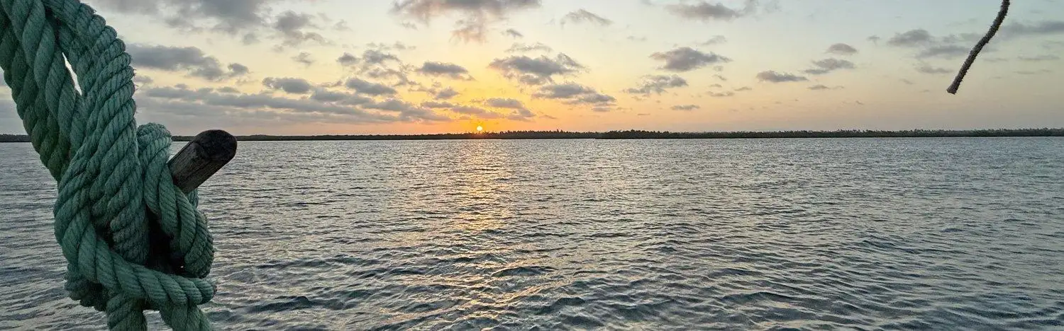 Mida Creek sunset dhow departure time versus sunset by month